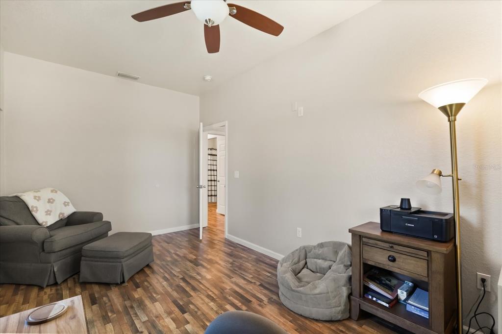 3865 Rabbit Run Road Wauchula, FL 33873 - Photo 6 of 43 a living room with furniture and a wooden floor