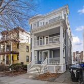 a front view of a building with many windows