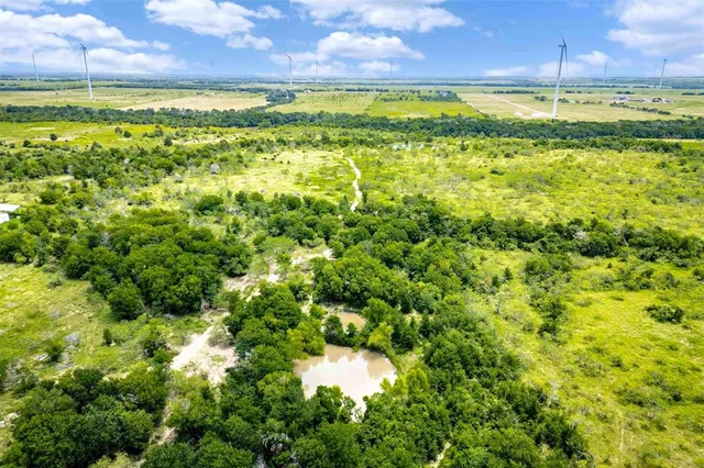 a view of a yard with a swimming pool