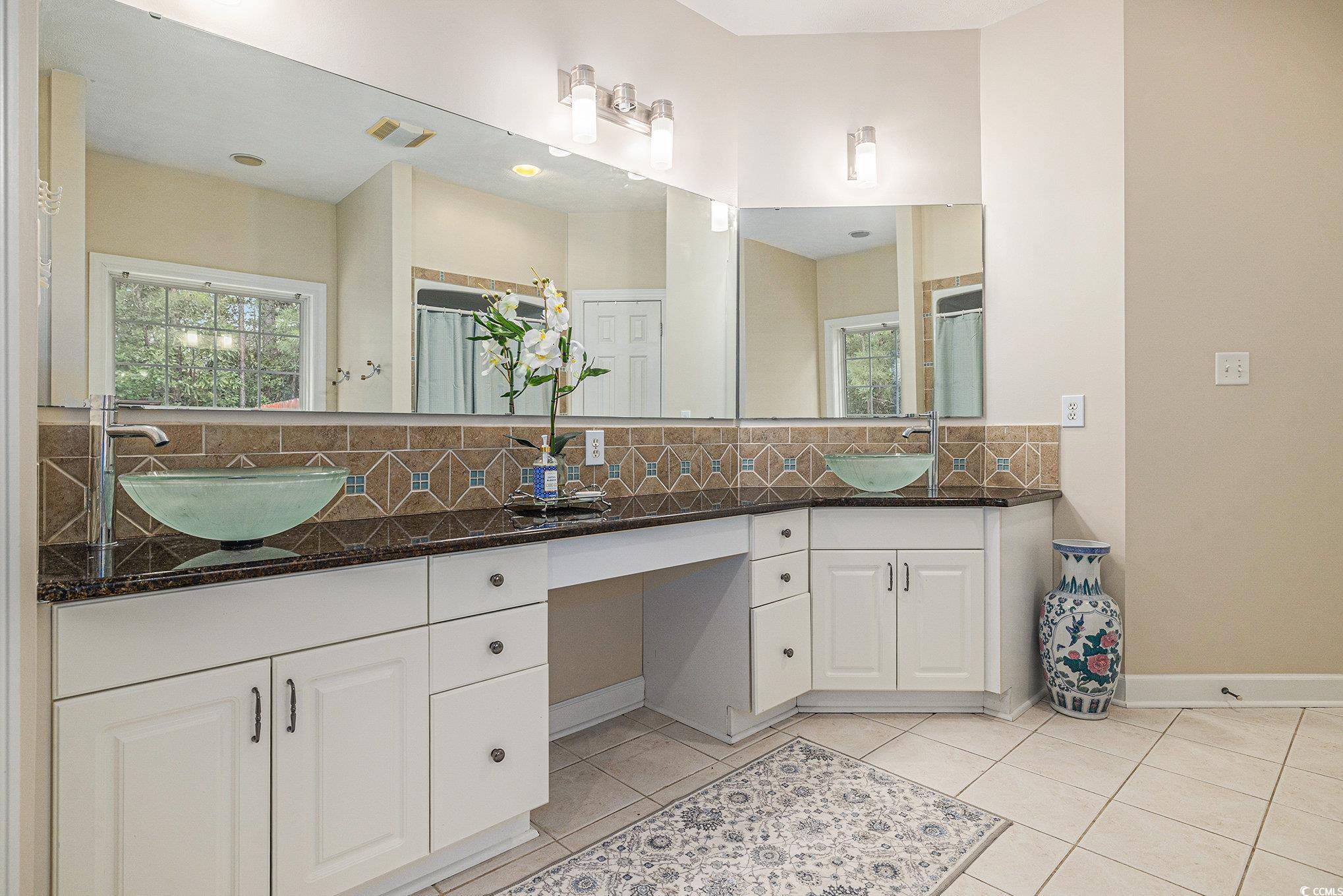 2425 Hunters Trail Myrtle Beach, SC 29588 - Photo 22 of 40 Bathroom featuring tasteful backsplash, tile patterned floors, and double vanity