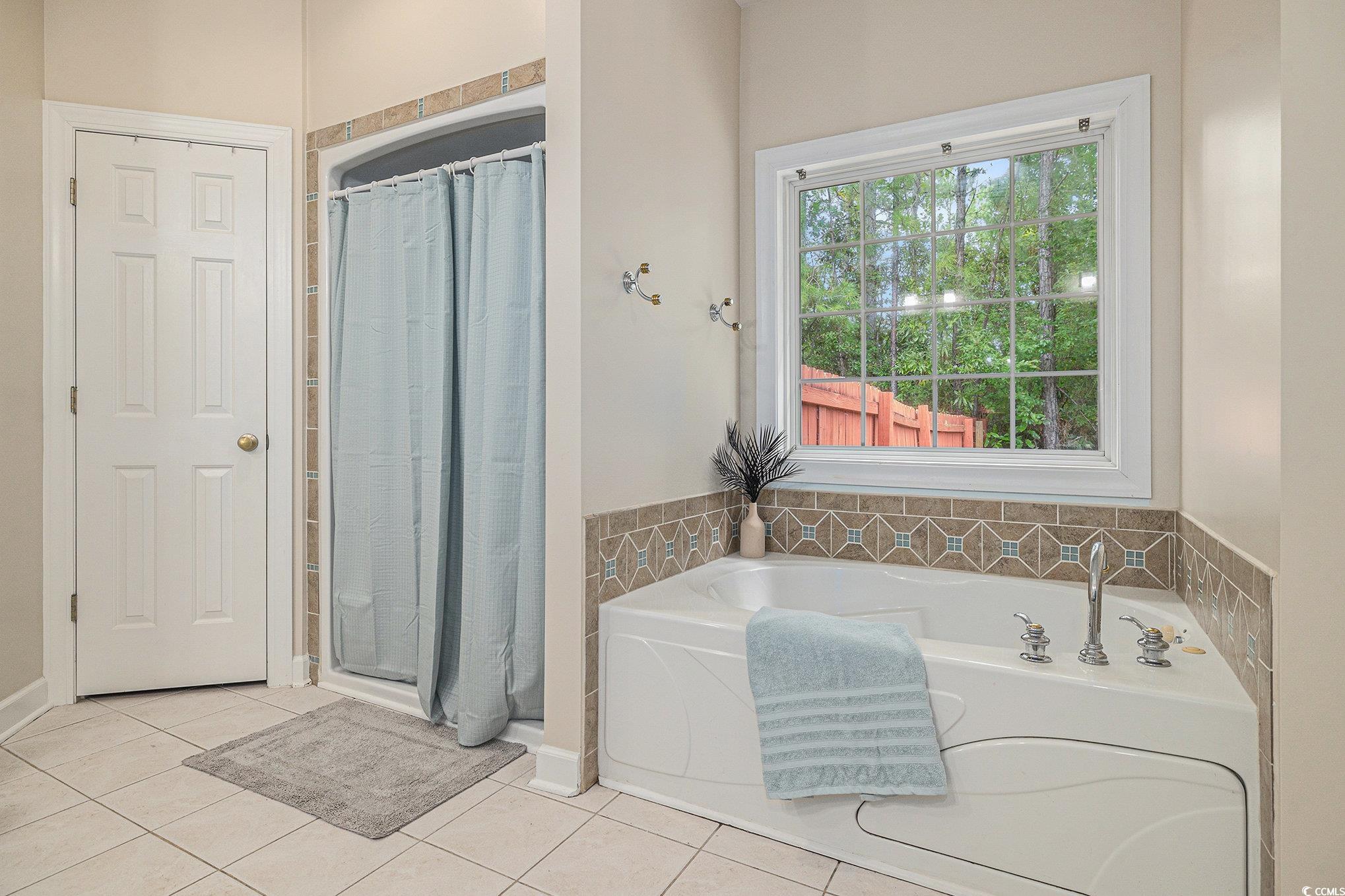 2425 Hunters Trail Myrtle Beach, SC 29588 - Photo 23 of 40 Full bathroom featuring a shower stall, a garden tub, and tile patterned floors