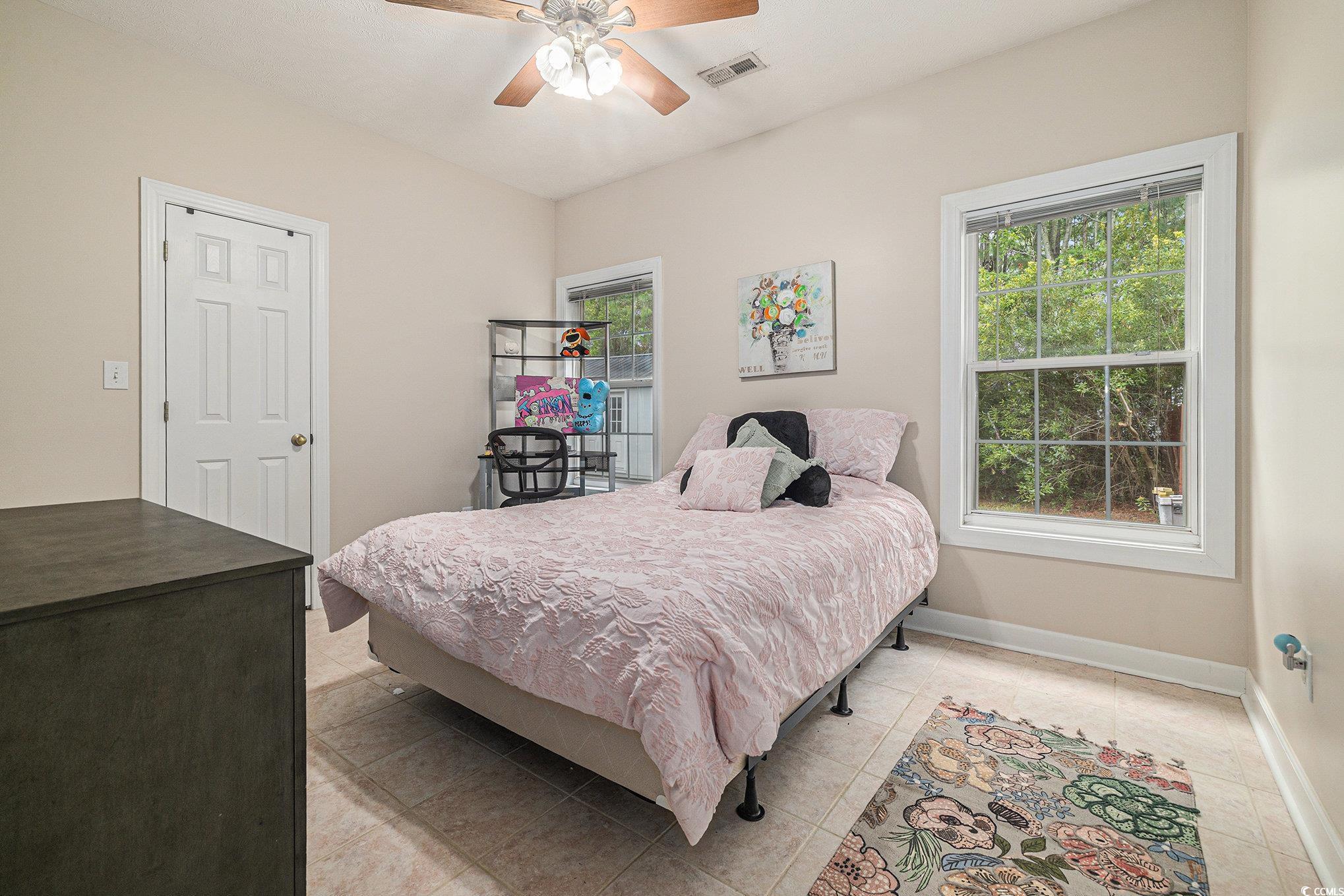2425 Hunters Trail Myrtle Beach, SC 29588 - Photo 26 of 40 Bedroom with a ceiling fan and light tile patterned floors