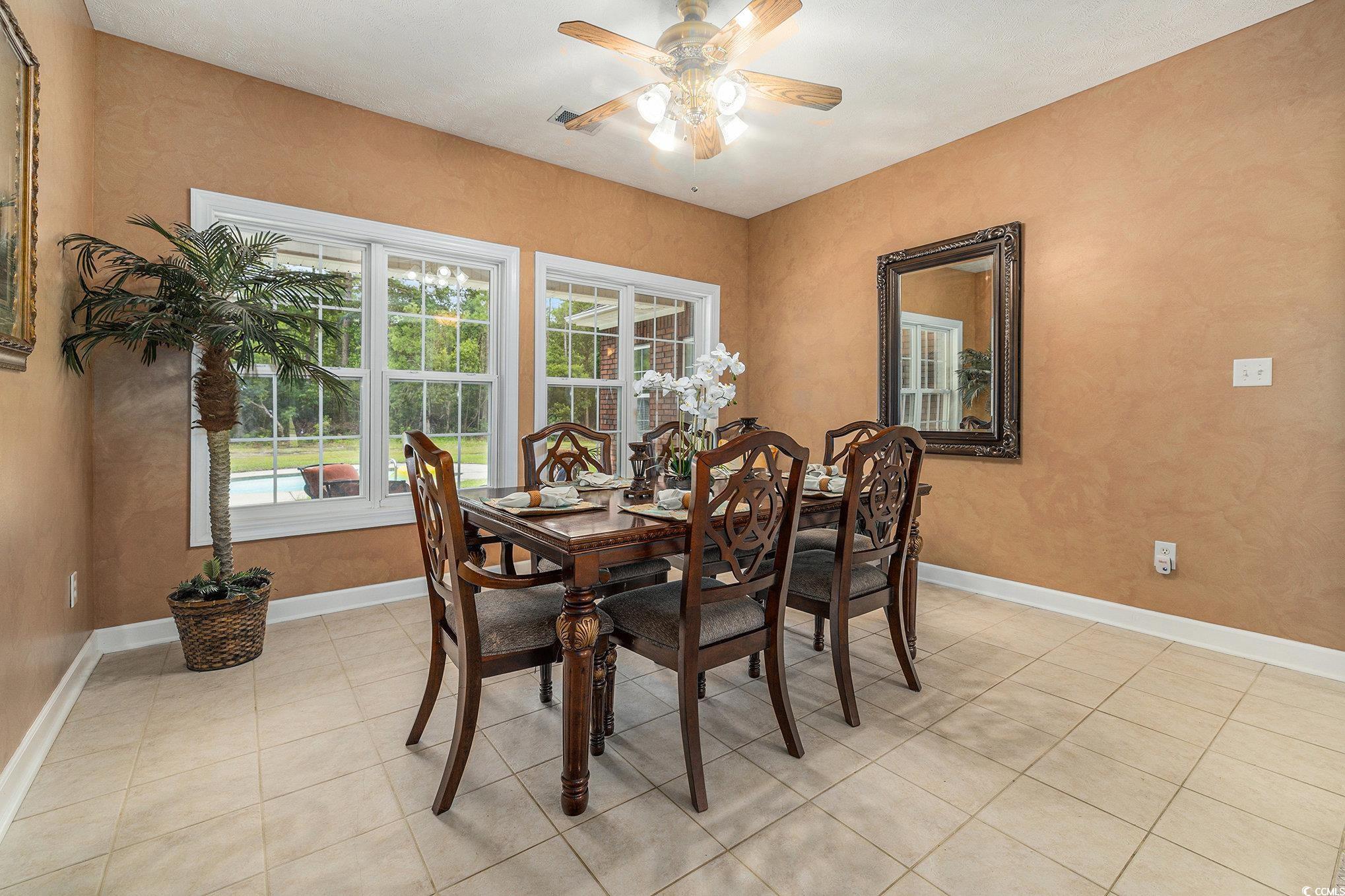 2425 Hunters Trail Myrtle Beach, SC 29588 - Photo 29 of 40 Dining area with light tile patterned flooring and ceiling fan