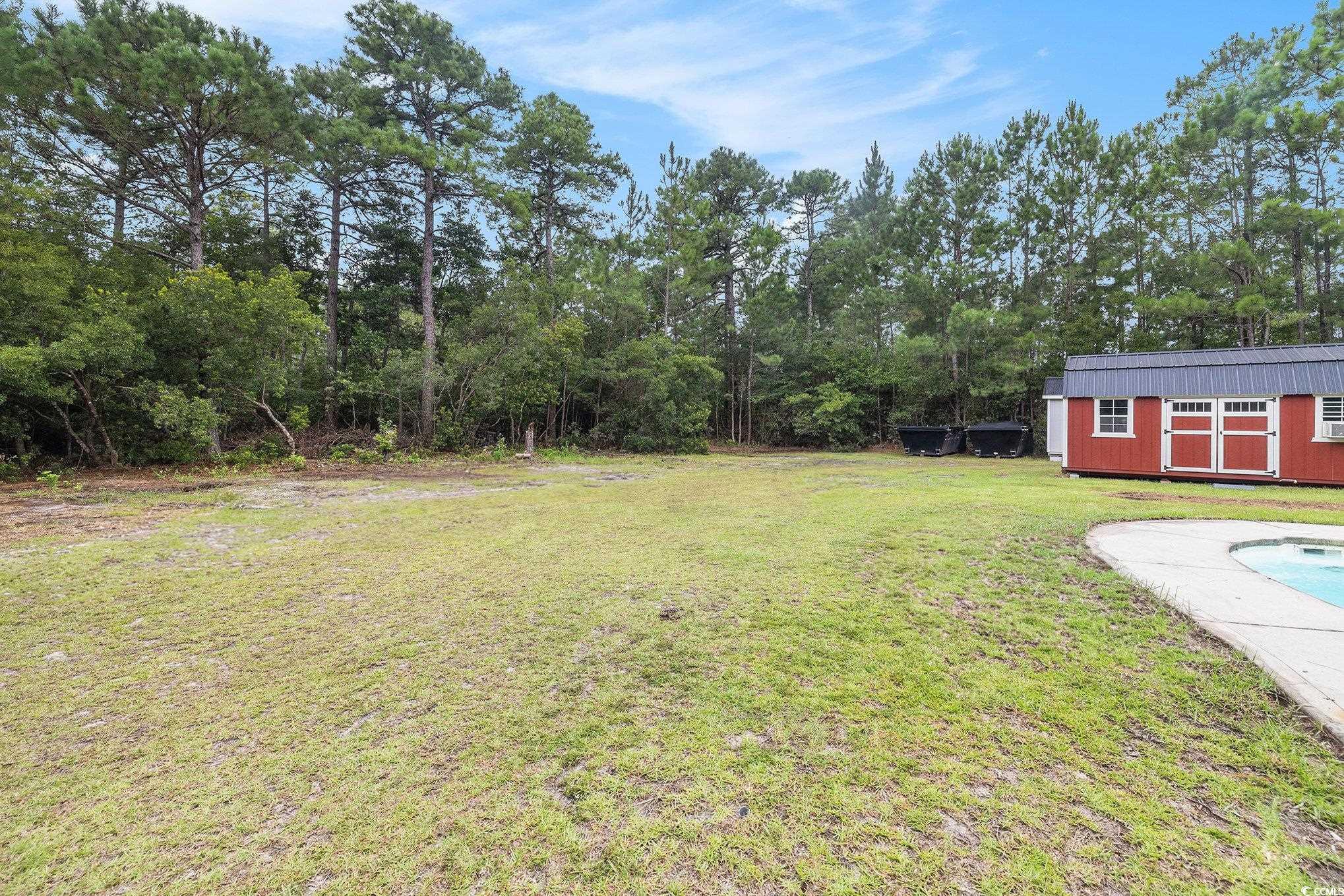 2425 Hunters Trail Myrtle Beach, SC 29588 - Photo 5 of 40 View of green lawn with outdoor pool