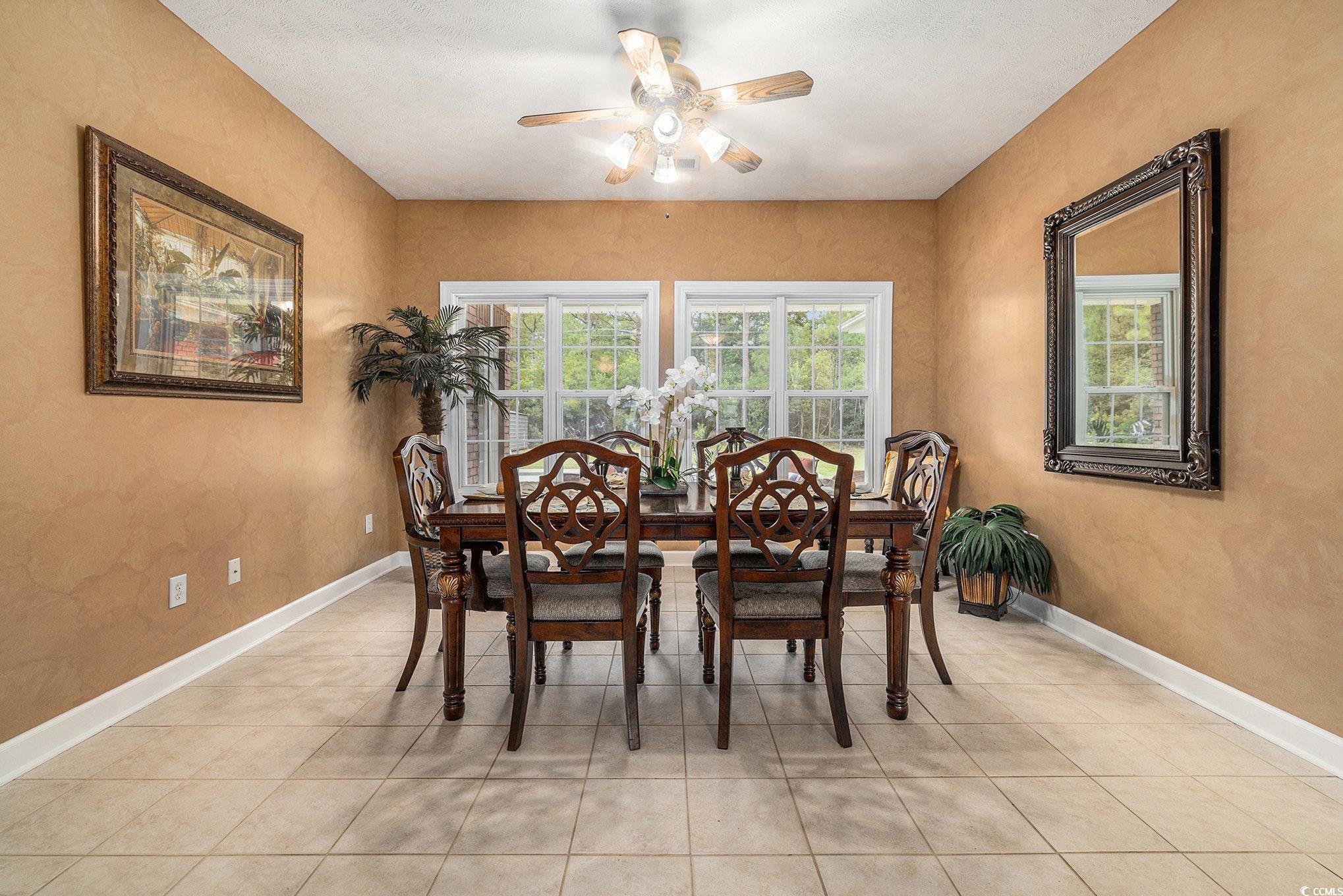 2425 Hunters Trail Myrtle Beach, SC 29588 - Photo 9 of 40 Dining room with light tile patterned floors and a ceiling fan