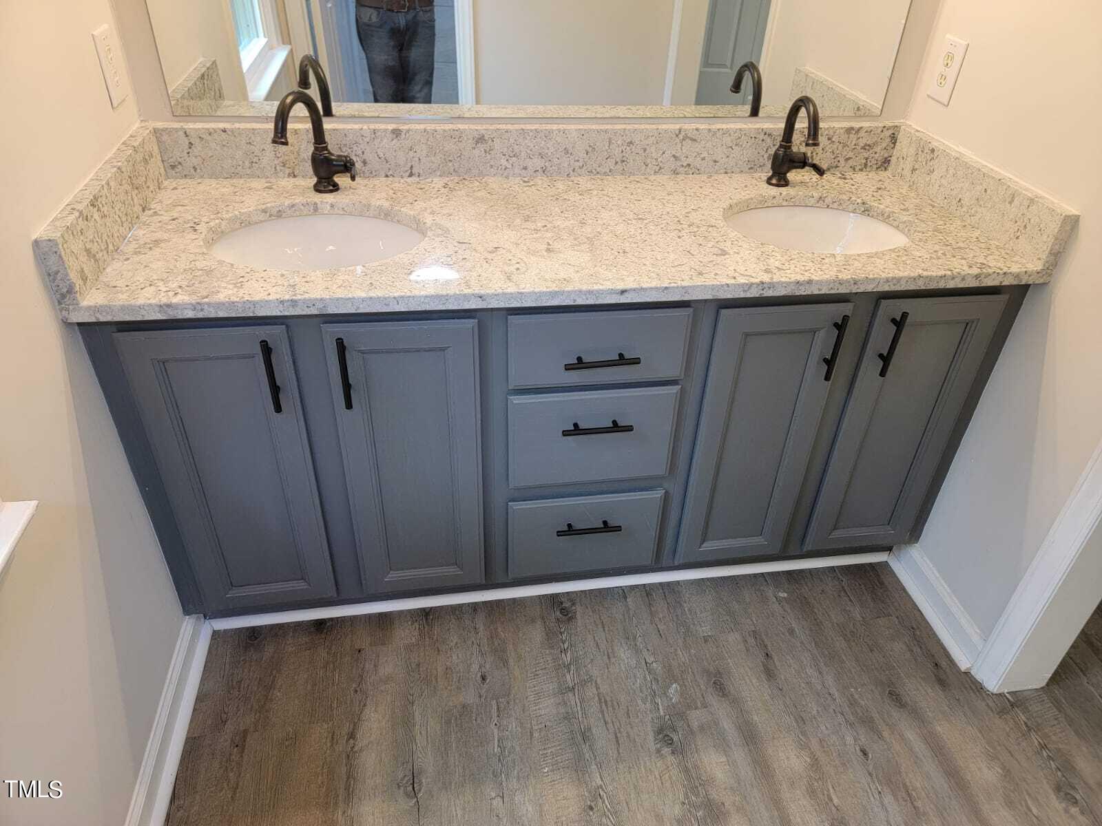 4008 Old Coach Road Raleigh, NC 27616 - Photo 39 of 48 a bathroom with a granite countertop sink and a mirror