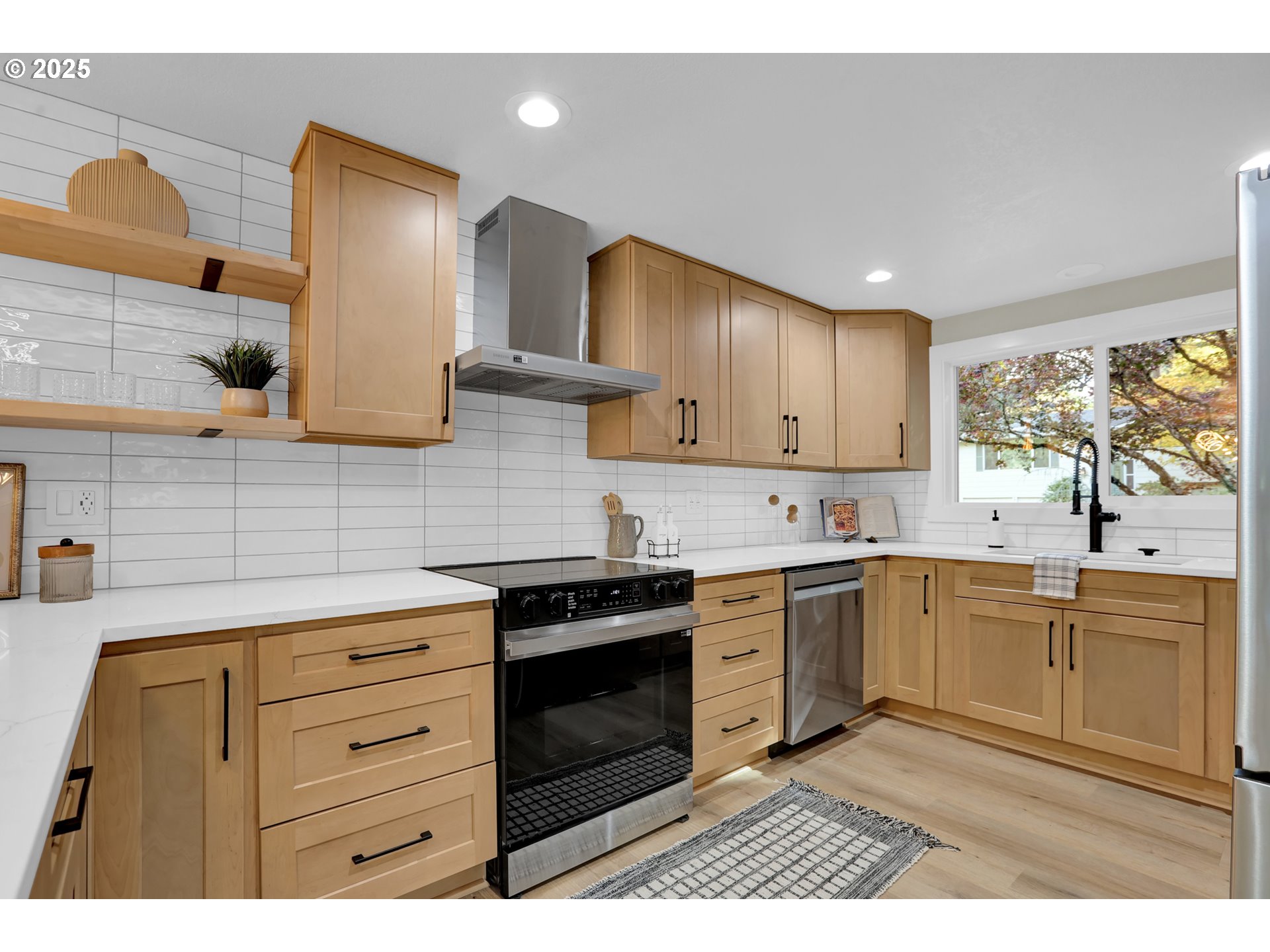 315 Brookside Drive Eugene, OR 97405 - Photo 11 of 46 a kitchen with stainless steel appliances granite countertop a stove sink and cabinets