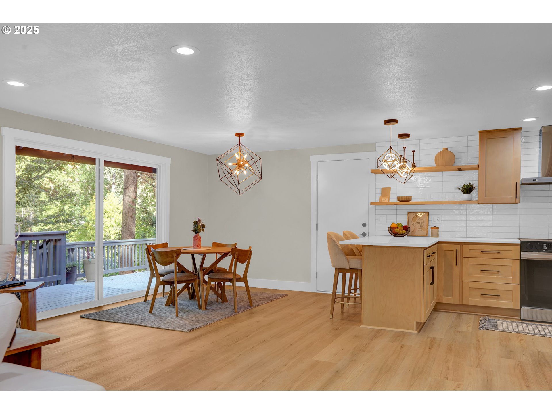 315 Brookside Drive Eugene, OR 97405 - Photo 13 of 46 a living room with stainless steel appliances kitchen island granite countertop furniture and a large window