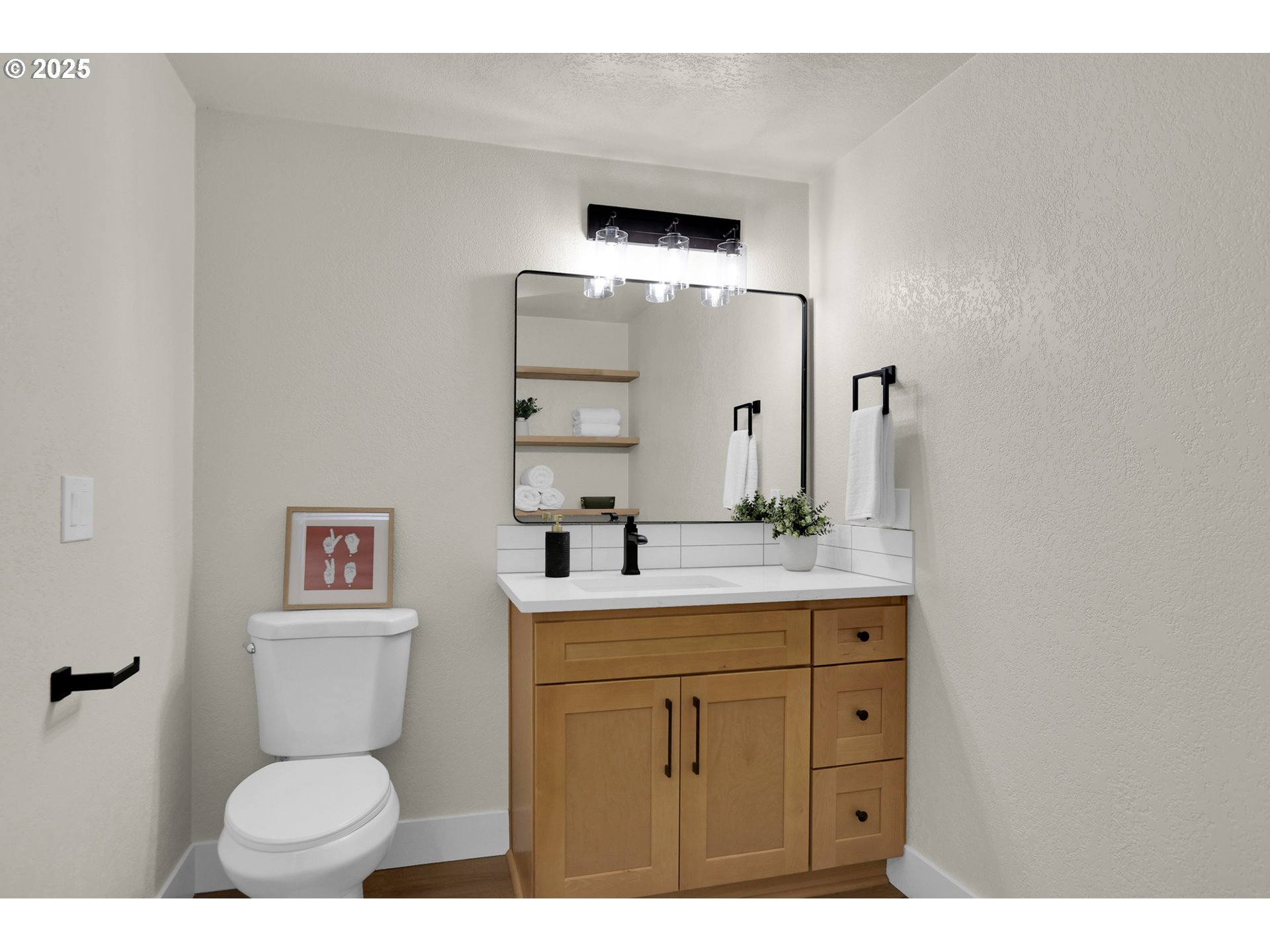 315 Brookside Drive Eugene, OR 97405 - Photo 16 of 46 a bathroom with a toilet sink and mirror