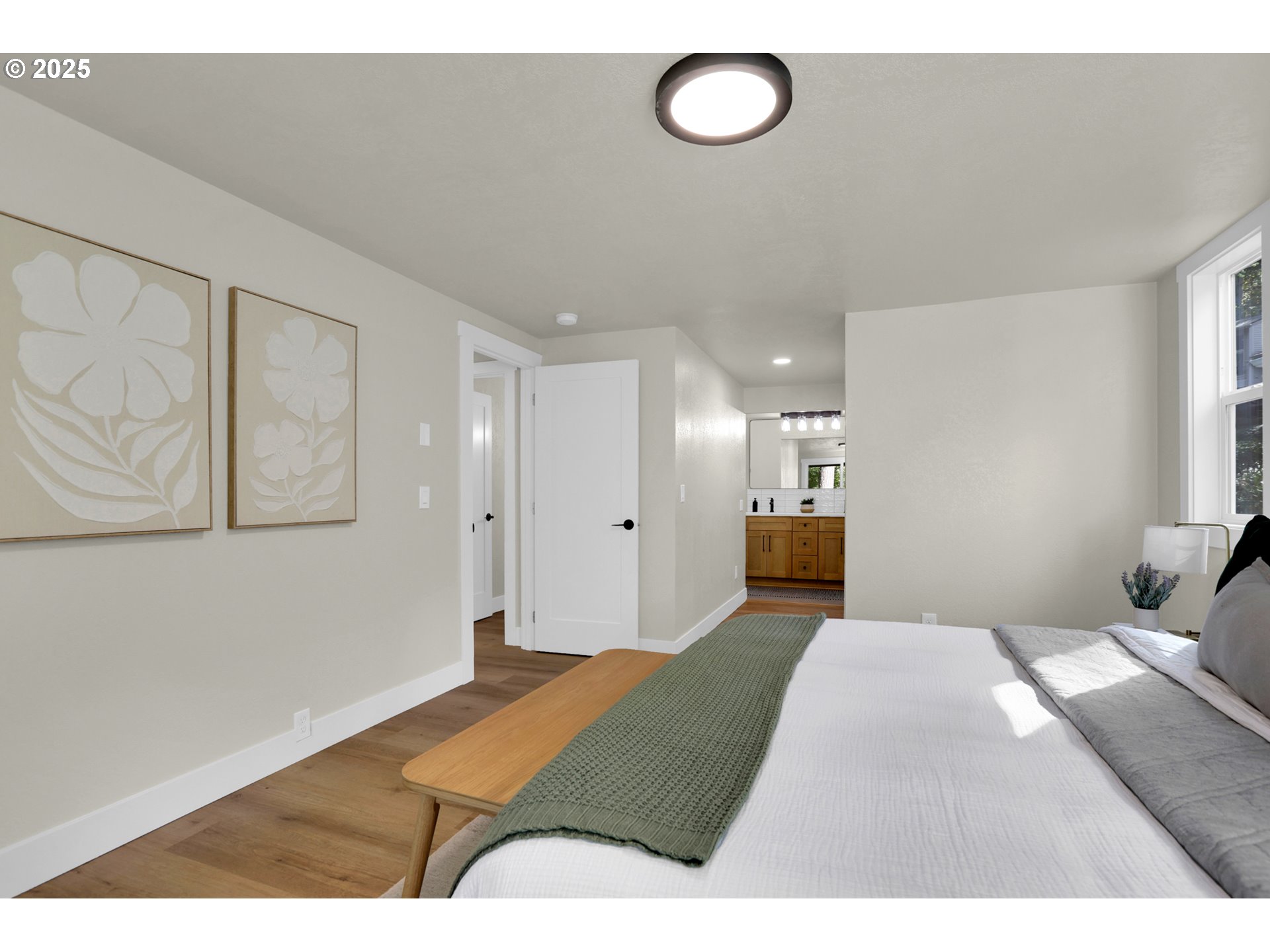 315 Brookside Drive Eugene, OR 97405 - Photo 19 of 46 a bedroom with a bed and painting on the wall