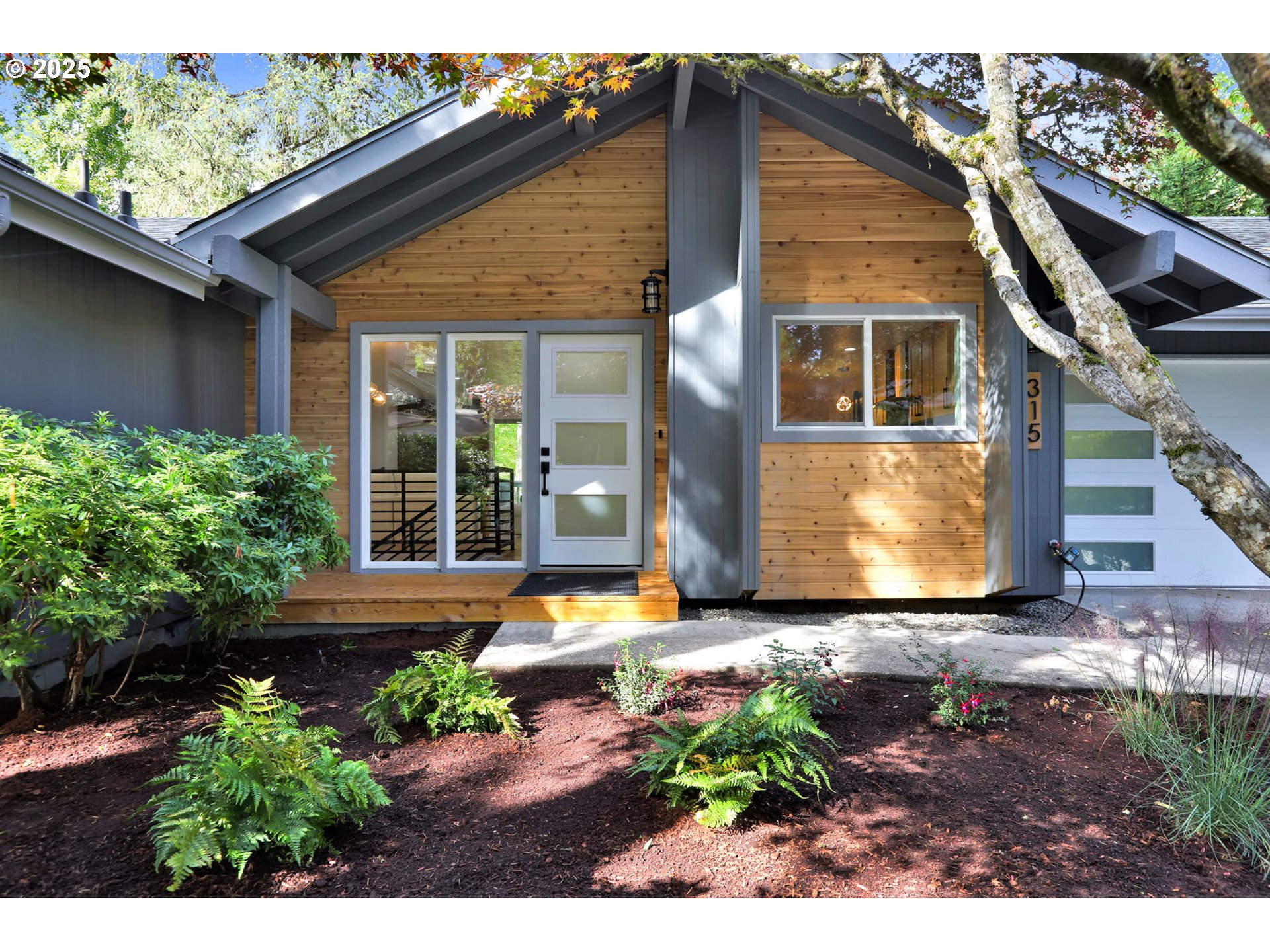 315 Brookside Drive Eugene, OR 97405 - Photo 2 of 46 a front view of a house with garden