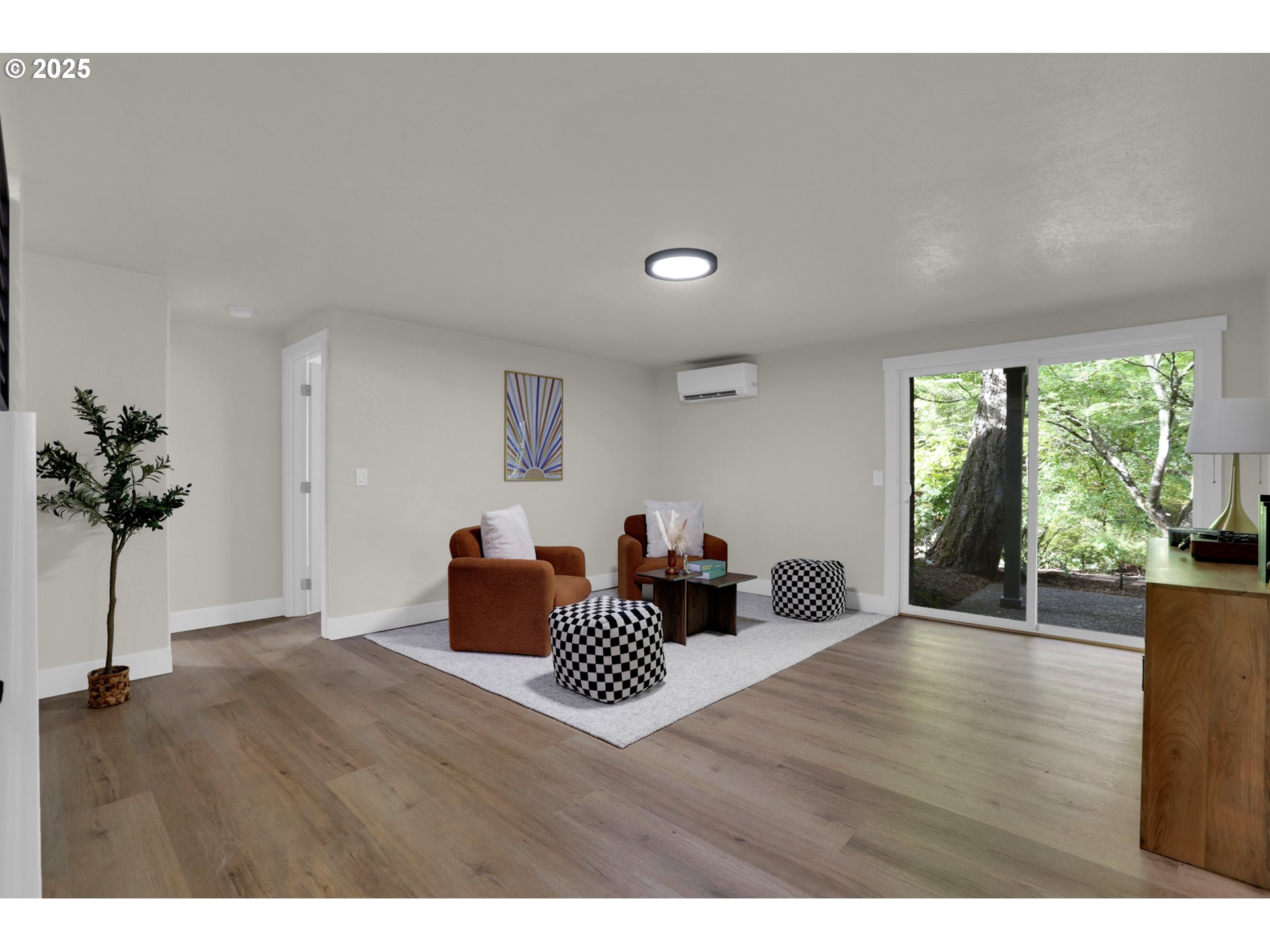 315 Brookside Drive Eugene, OR 97405 - Photo 29 of 46 a room with furniture and a potted plant