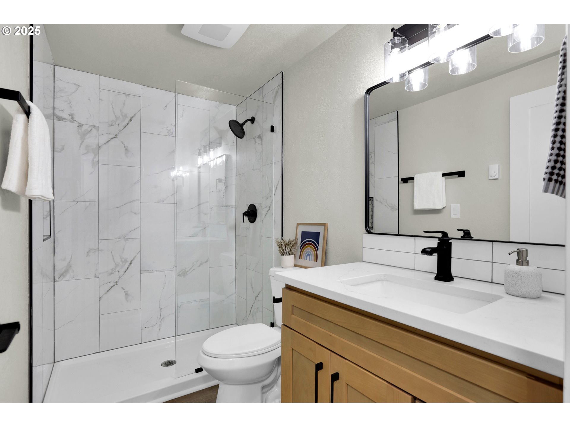 315 Brookside Drive Eugene, OR 97405 - Photo 35 of 46 a bathroom with a sink a toilet a mirror and shower