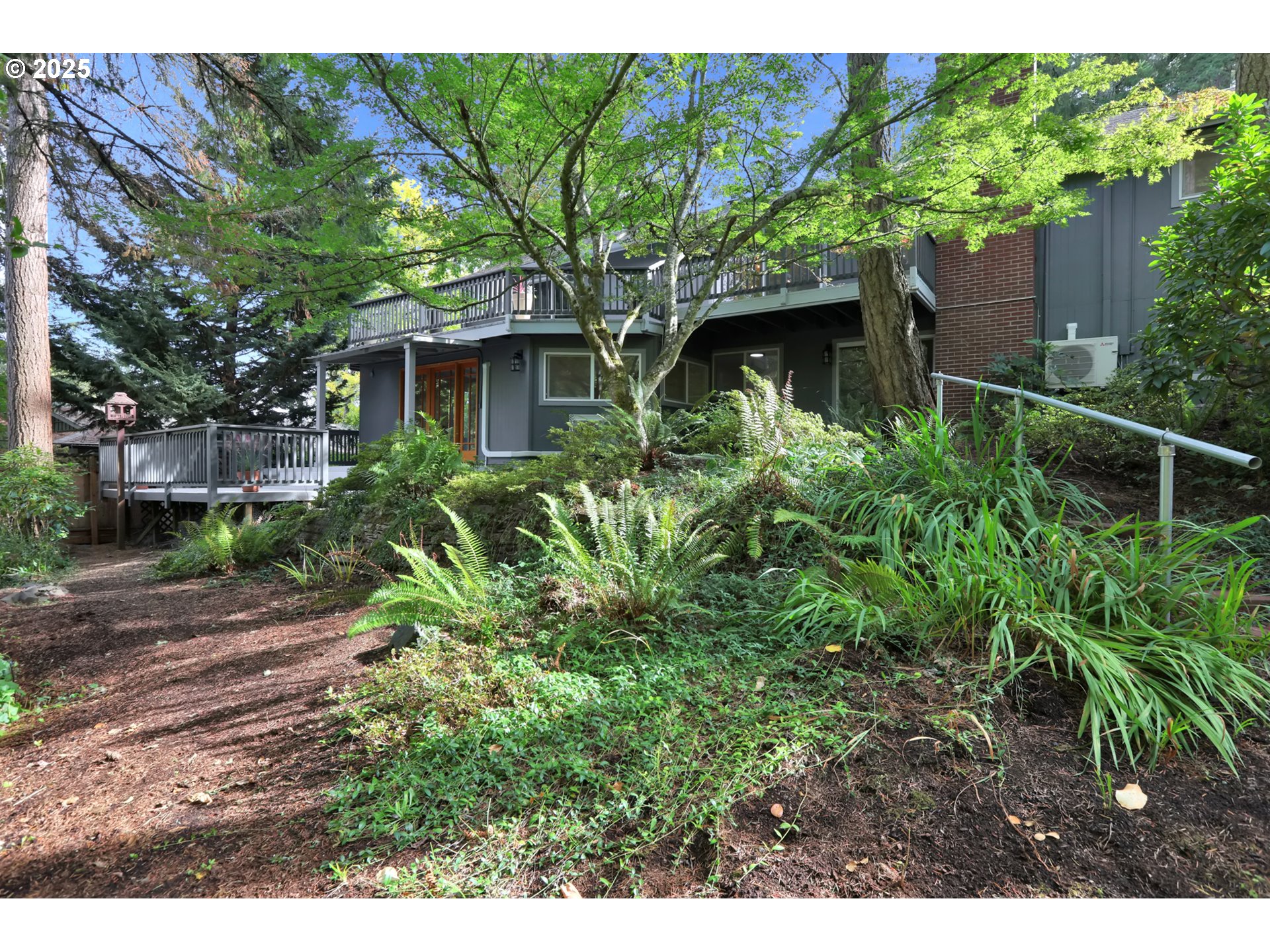 315 Brookside Drive Eugene, OR 97405 - Photo 45 of 46 a view of a house with a tree in the background