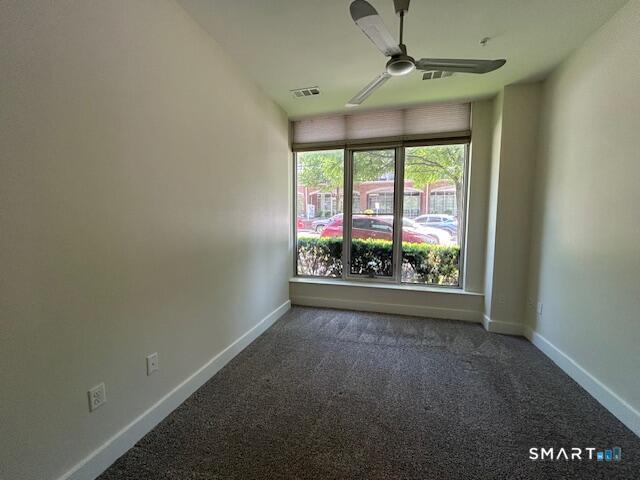 111 Morgan Street, Unit TH5 Stamford, CT 06905 - Photo 5 of 23 an empty room with windows
