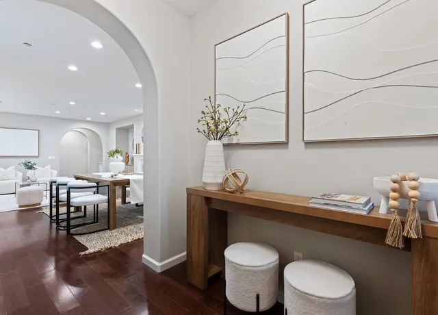 a bathroom with a granite countertop sink and a toilet