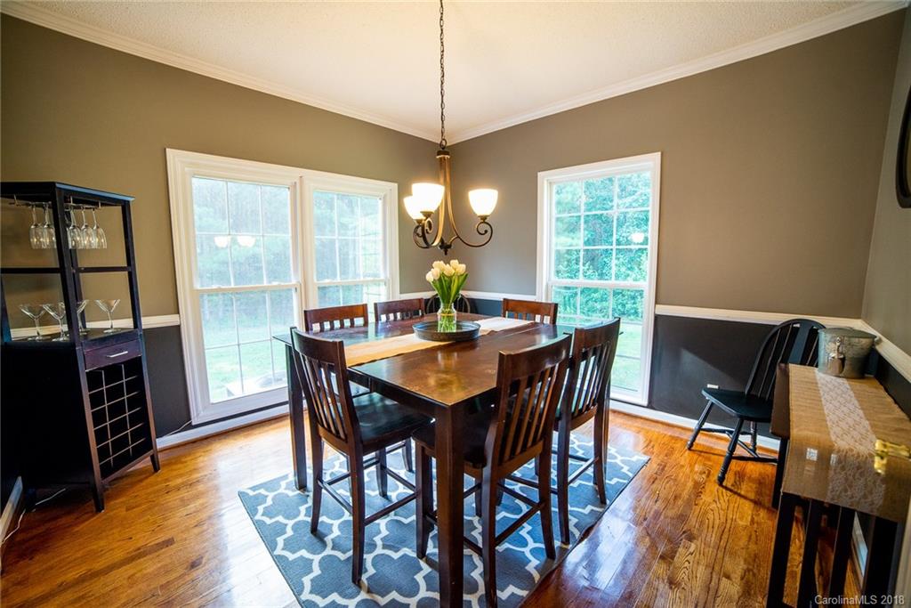4225 Rowell Road Lancaster, SC 29720 - Photo 13 of 34 a view of a dining room with furniture window and wooden floor
