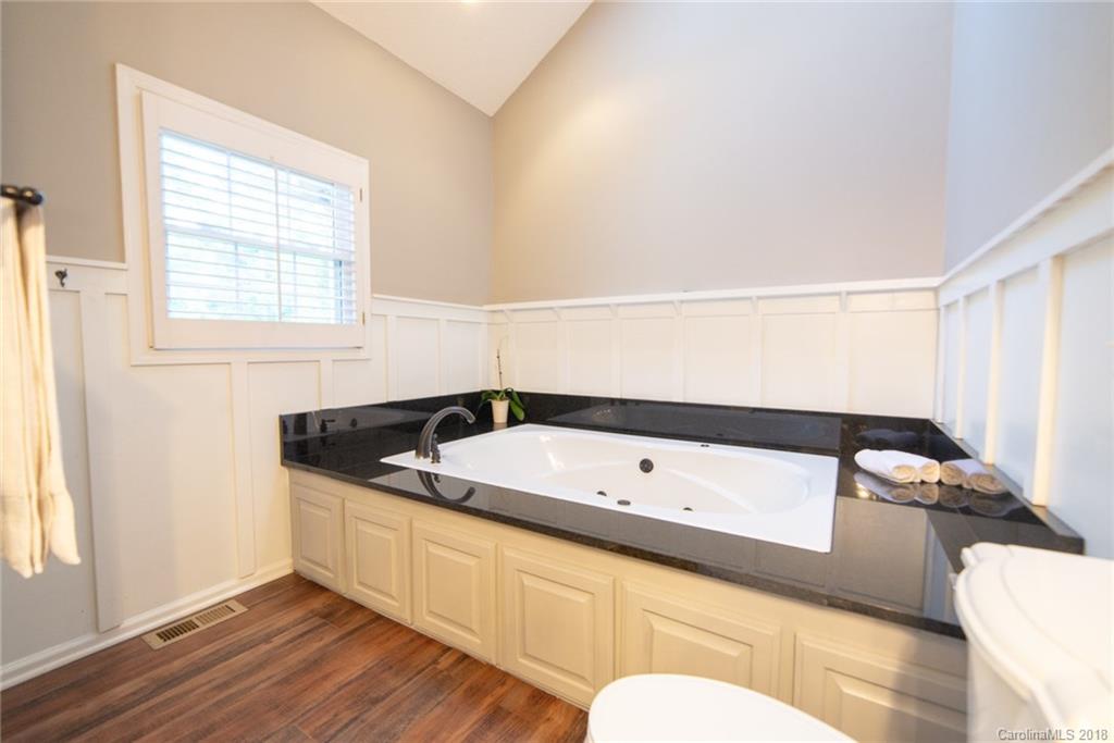 4225 Rowell Road Lancaster, SC 29720 - Photo 19 of 34 a bathroom with a bathtub and a window