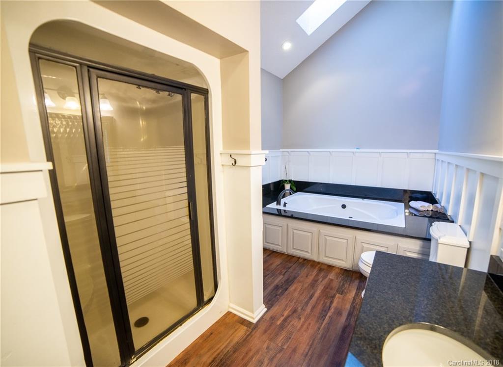 4225 Rowell Road Lancaster, SC 29720 - Photo 20 of 34 a room with wooden floor and furniture