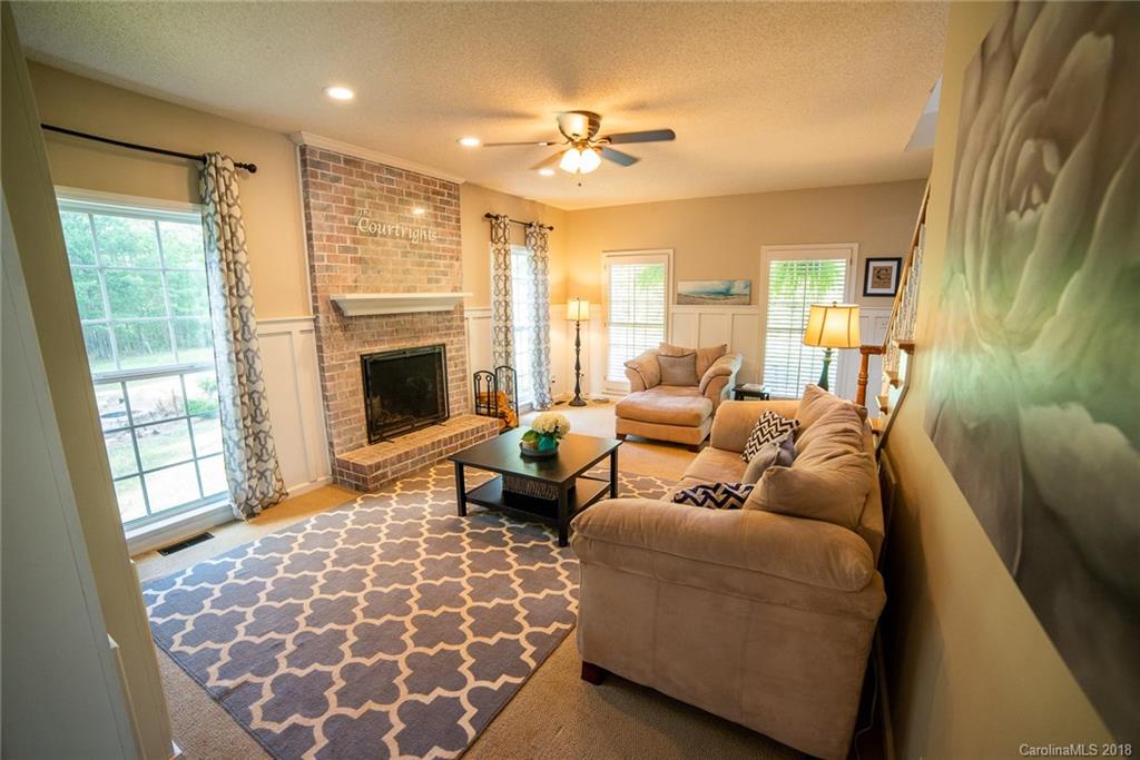 4225 Rowell Road Lancaster, SC 29720 - Photo 3 of 34 a living room with furniture and a fireplace