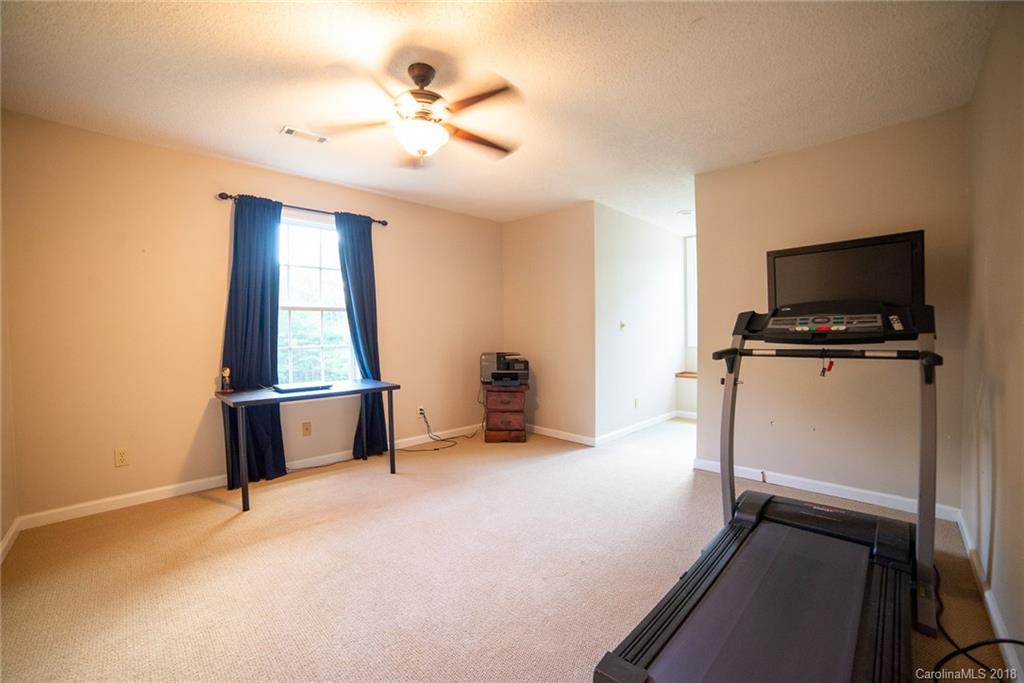 4225 Rowell Road Lancaster, SC 29720 - Photo 22 of 34 wooden floor chandelier and windows in a room