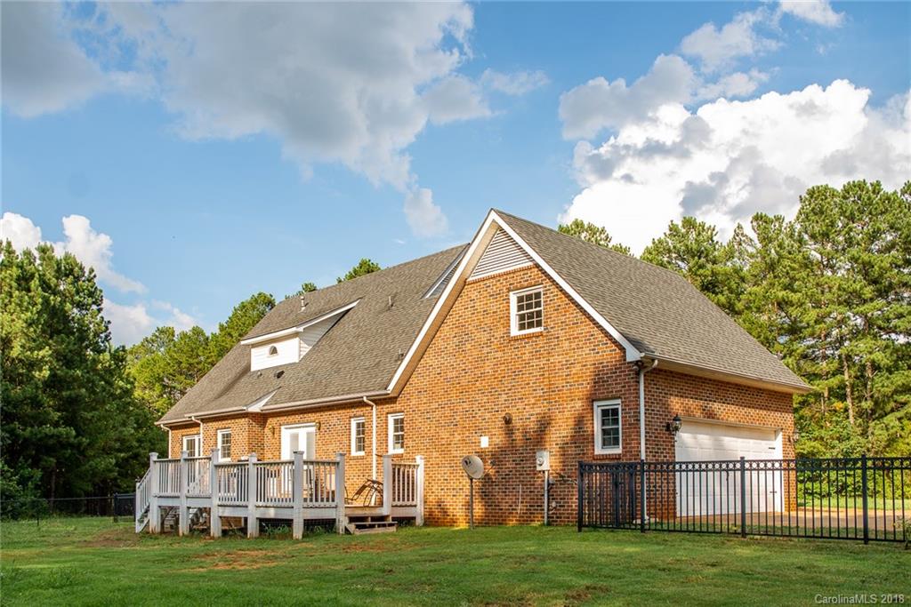 4225 Rowell Road Lancaster, SC 29720 - Photo 33 of 34 a view of a big house with a big yard and large trees