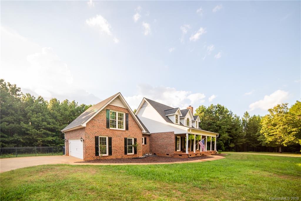 4225 Rowell Road Lancaster, SC 29720 - Photo 34 of 34 a front view of a house with a yard and lake view