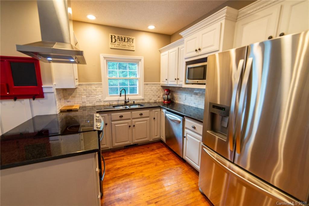 4225 Rowell Road Lancaster, SC 29720 - Photo 5 of 34 a kitchen with stainless steel appliances a refrigerator sink and microwave
