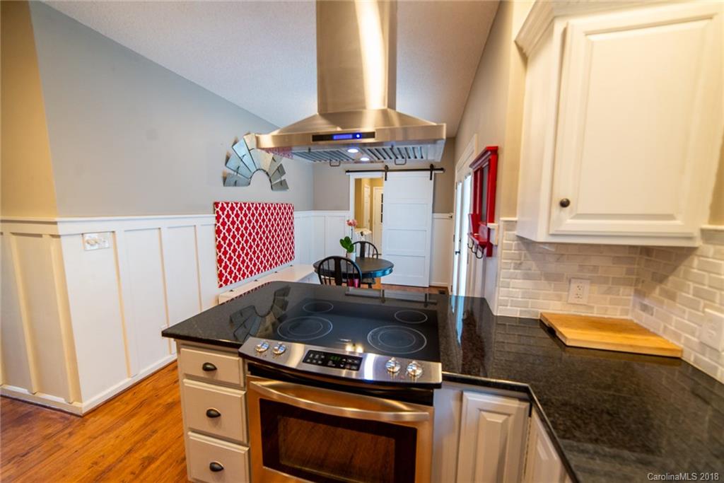 4225 Rowell Road Lancaster, SC 29720 - Photo 7 of 34 a kitchen with granite countertop a stove and a sink