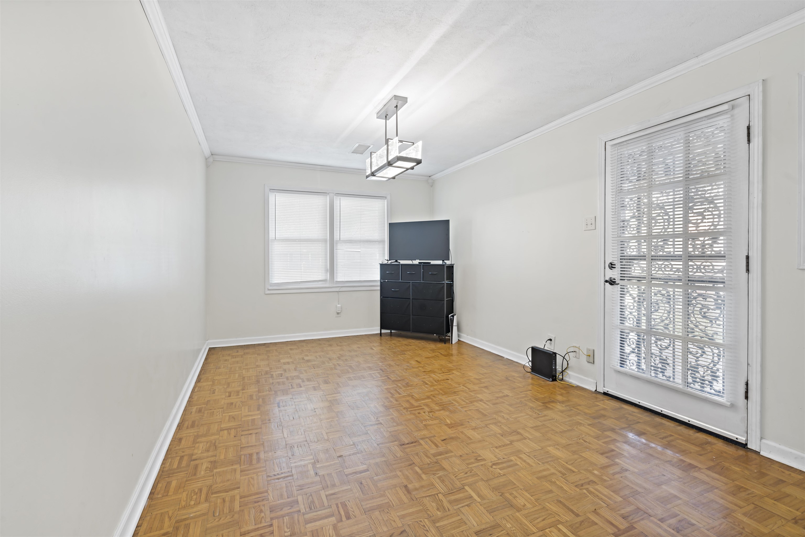 1700 South White Station Road Memphis, TN 38117 - Photo 10 of 11 wooden floor in an empty room with a window