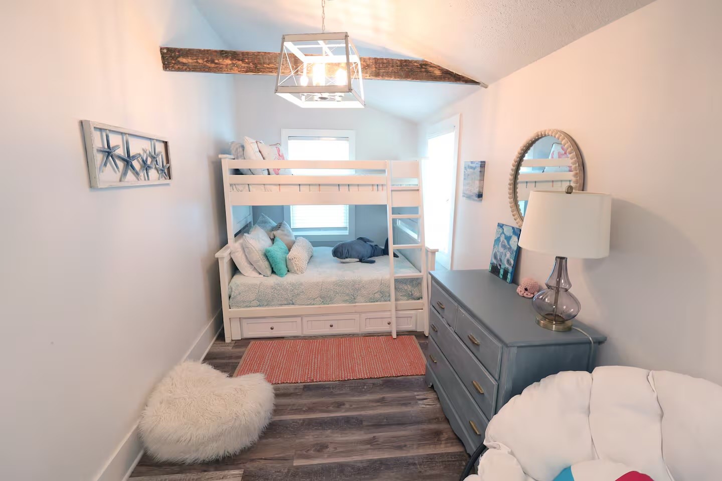 310 Shark Lane Surfside Beach, TX 77541 - Photo 12 of 33 a bedroom with a bed mirror and window