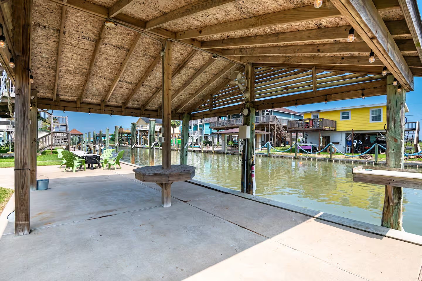 310 Shark Lane Surfside Beach, TX 77541 - Photo 18 of 33 a view of a swimming pool with outdoor seating