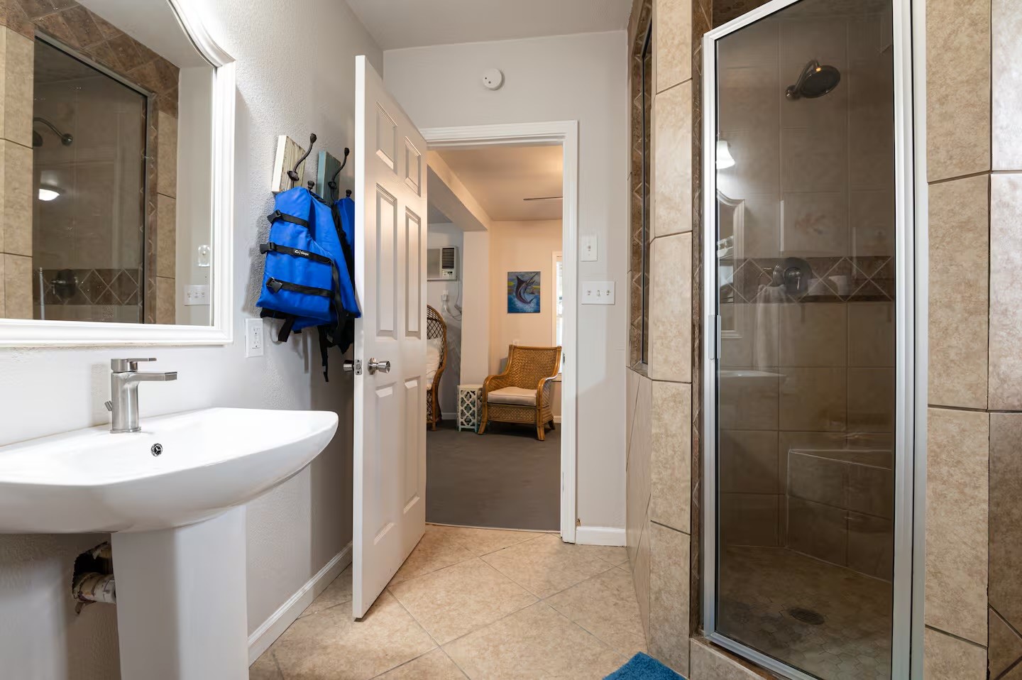 310 Shark Lane Surfside Beach, TX 77541 - Photo 24 of 33 a en suite bathroom with a sink and a mirror