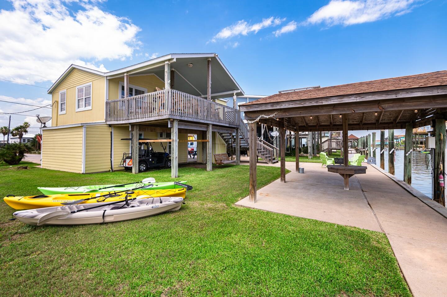310 Shark Lane Surfside Beach, TX 77541 - Photo 32 of 33 a front view of a house with a yard table and chairs
