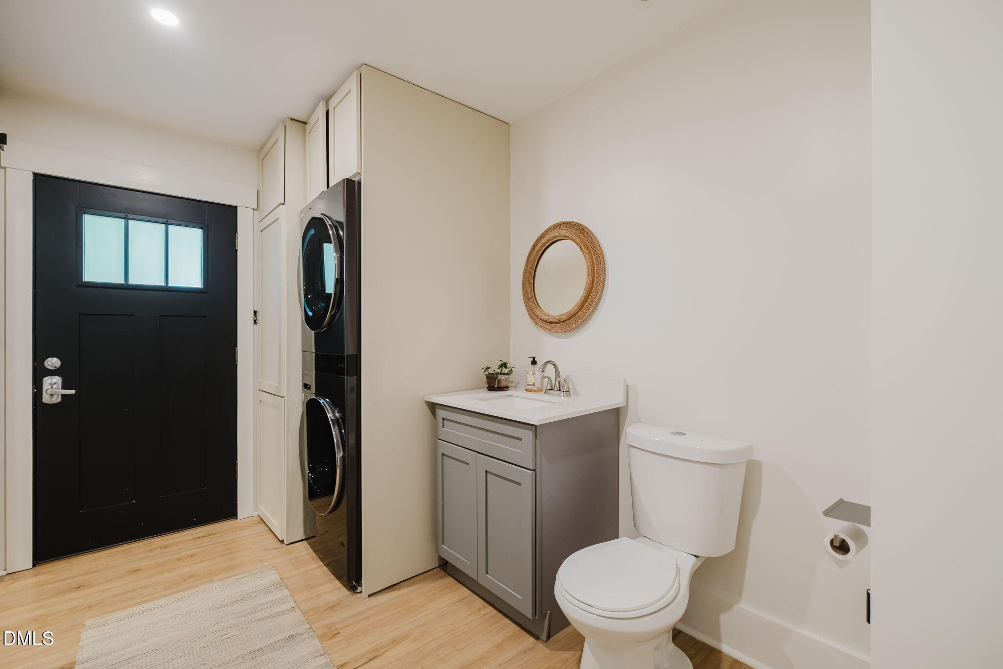 370 Robinson Ferry Road Macon, NC 27551 - Photo 42 of 85 a bathroom with a toilet a sink and a mirror