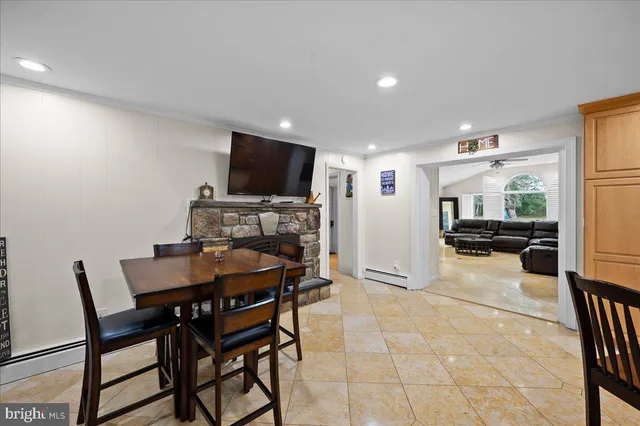 a white toilet sitting next to a bathroom sink