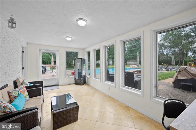 a bathroom with a sink a mirror a vanity and a shower