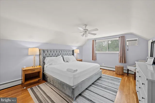 a bedroom with furniture and a chandelier
