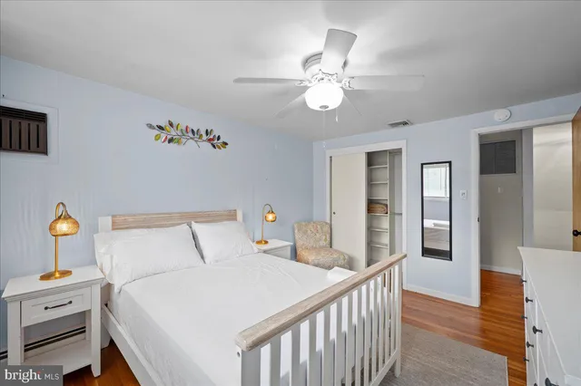 a bathroom with a bathtub a window and a shower