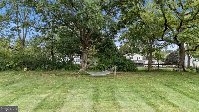 an aerial view of a house with a yard and balcony