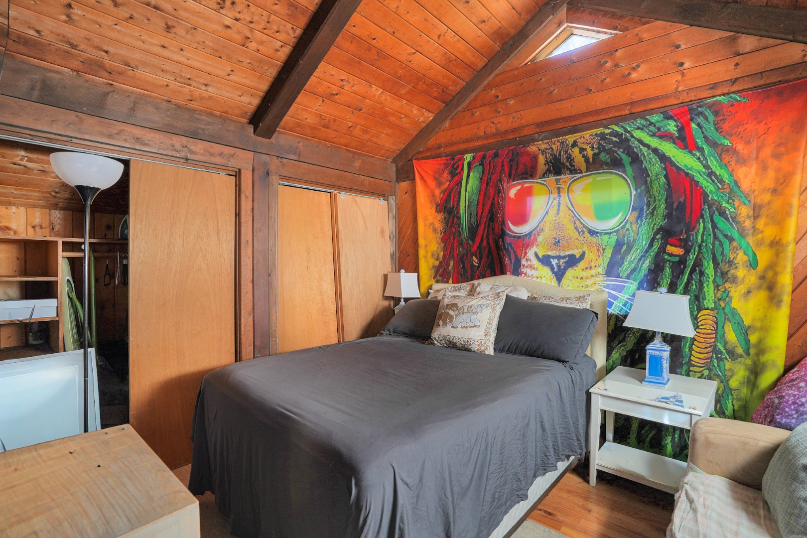 25 Vineyard Meadow Farms Road West Tisbury, MA 02568 - Photo 11 of 18 a bedroom with a bed and a painting on the wall