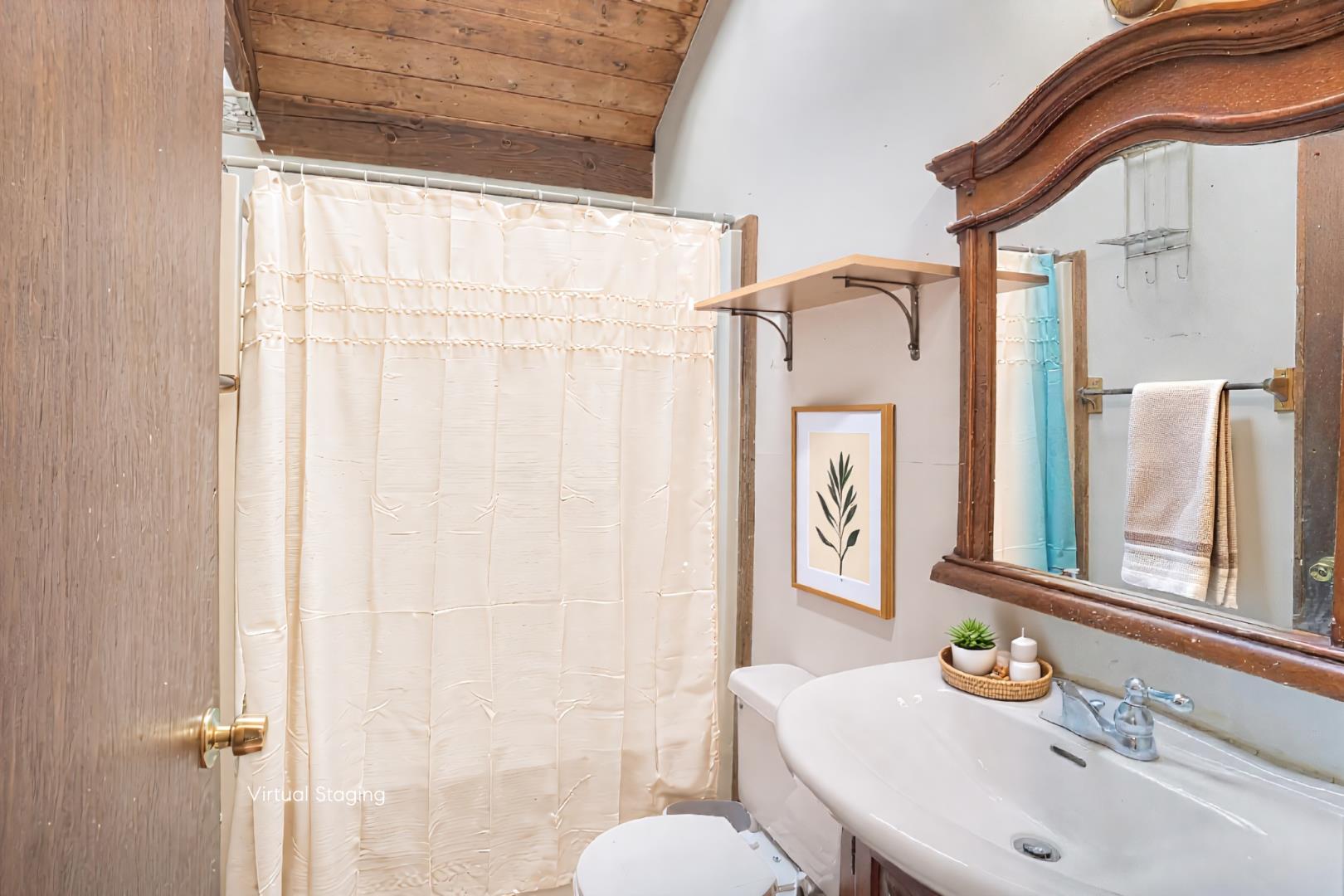 25 Vineyard Meadow Farms Road West Tisbury, MA 02568 - Photo 11 of 30 a bathroom with a sink a toilet and a mirror