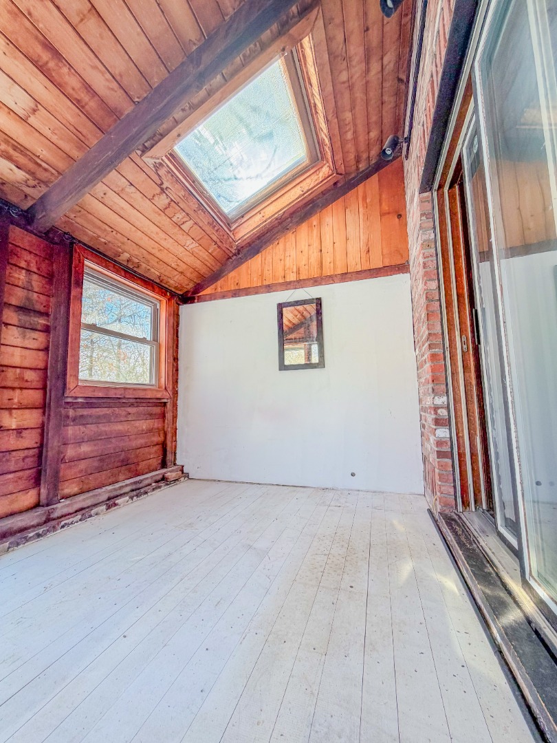 25 Vineyard Meadow Farms Road West Tisbury, MA 02568 - Photo 19 of 30 a view of an empty room with a window