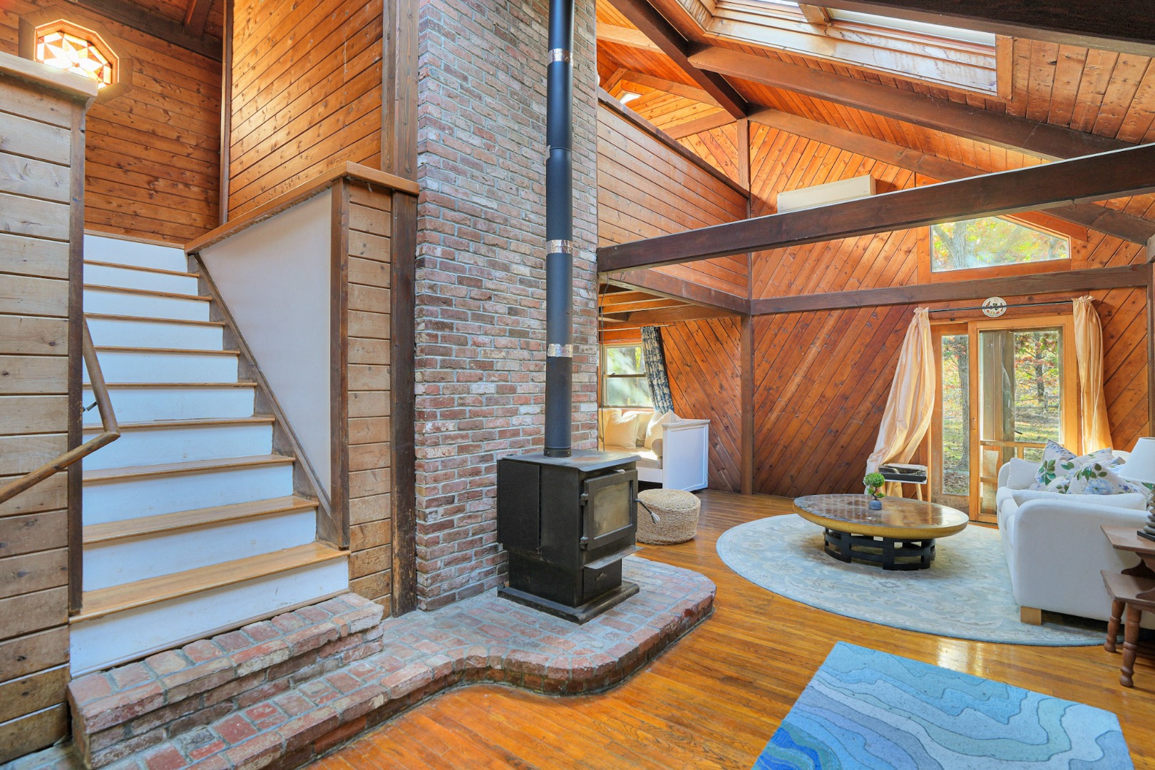 25 Vineyard Meadow Farms Road West Tisbury, MA 02568 - Photo 2 of 18 a view of a livingroom with furniture and floor to ceiling windows