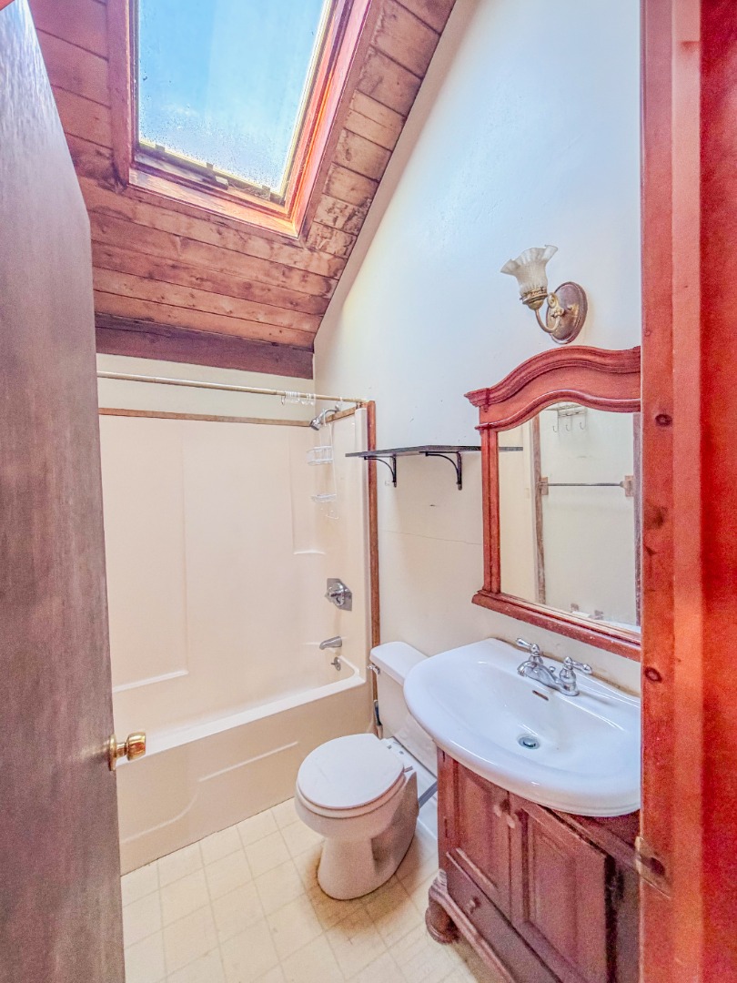 25 Vineyard Meadow Farms Road West Tisbury, MA 02568 - Photo 28 of 30 a bathroom with a sink a toilet and shower