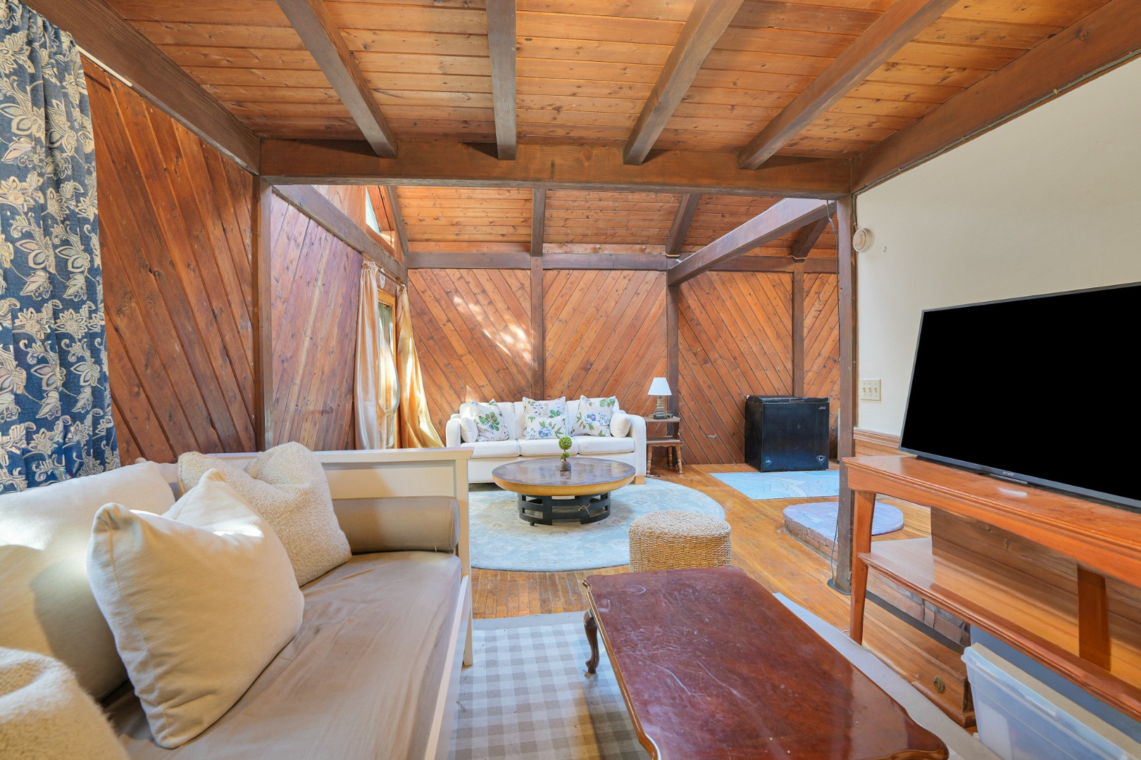 25 Vineyard Meadow Farms Road West Tisbury, MA 02568 - Photo 3 of 18 a outdoor living space with furniture and a flat screen tv