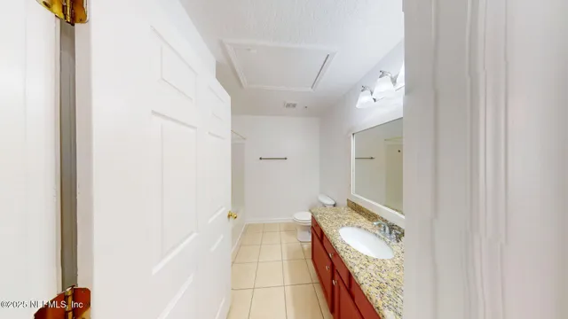 a view of a hallway with a white walls