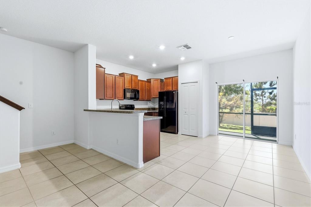 12909 Dream Catcher Way Riverview, FL 33579 - Photo 10 of 32 a view of kitchen with refrigerator and window