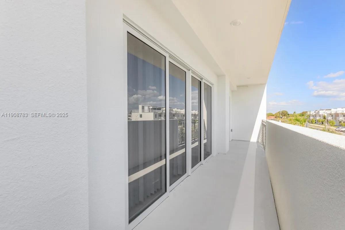 25850 Southwest 140th Court, Unit 7506 Homestead, FL 33032 - Photo 13 of 24 a view of hallway with wooden floor