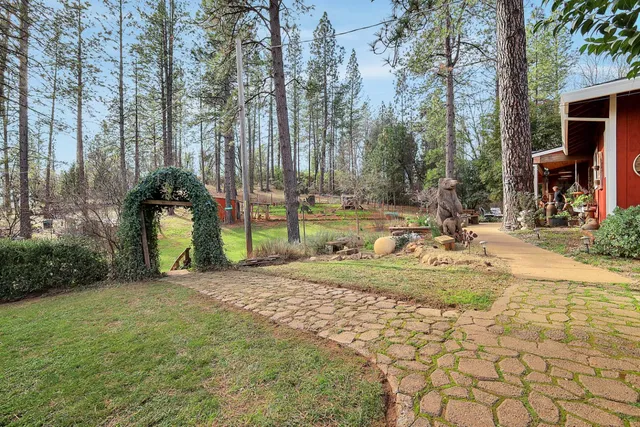 a view of a dining room with furniture and a flat screen tv